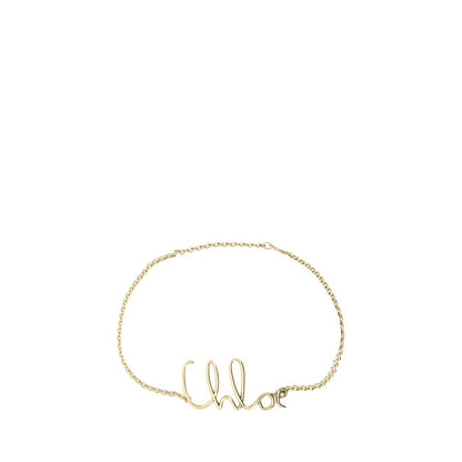 Belt by Chloé for women in brass gold, patterned & monogram features a bohemian chic silhouette, showcasing the bohemian chic Brass Belt design with a sophisticated bohemian chic finish.