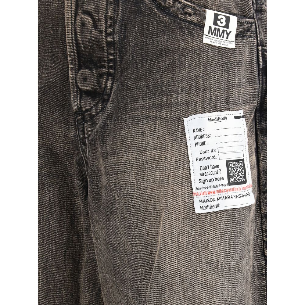 Jeans by Maison Mihara Yasuhiro for women in denim cotton black features a polished silhouette with a polished wide & oversized, reaching a polished long and finished with a polished .