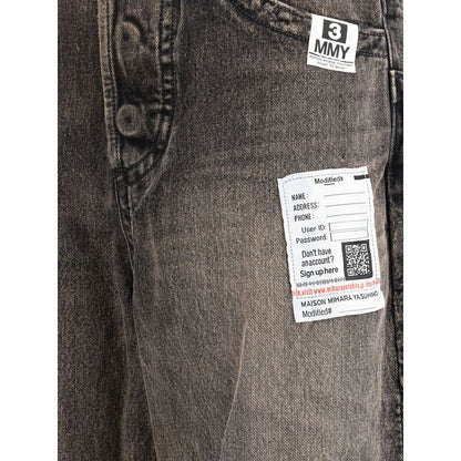 Jeans by Maison Mihara Yasuhiro for women in denim cotton black features a polished silhouette with a polished wide & oversized, reaching a polished long and finished with a polished .