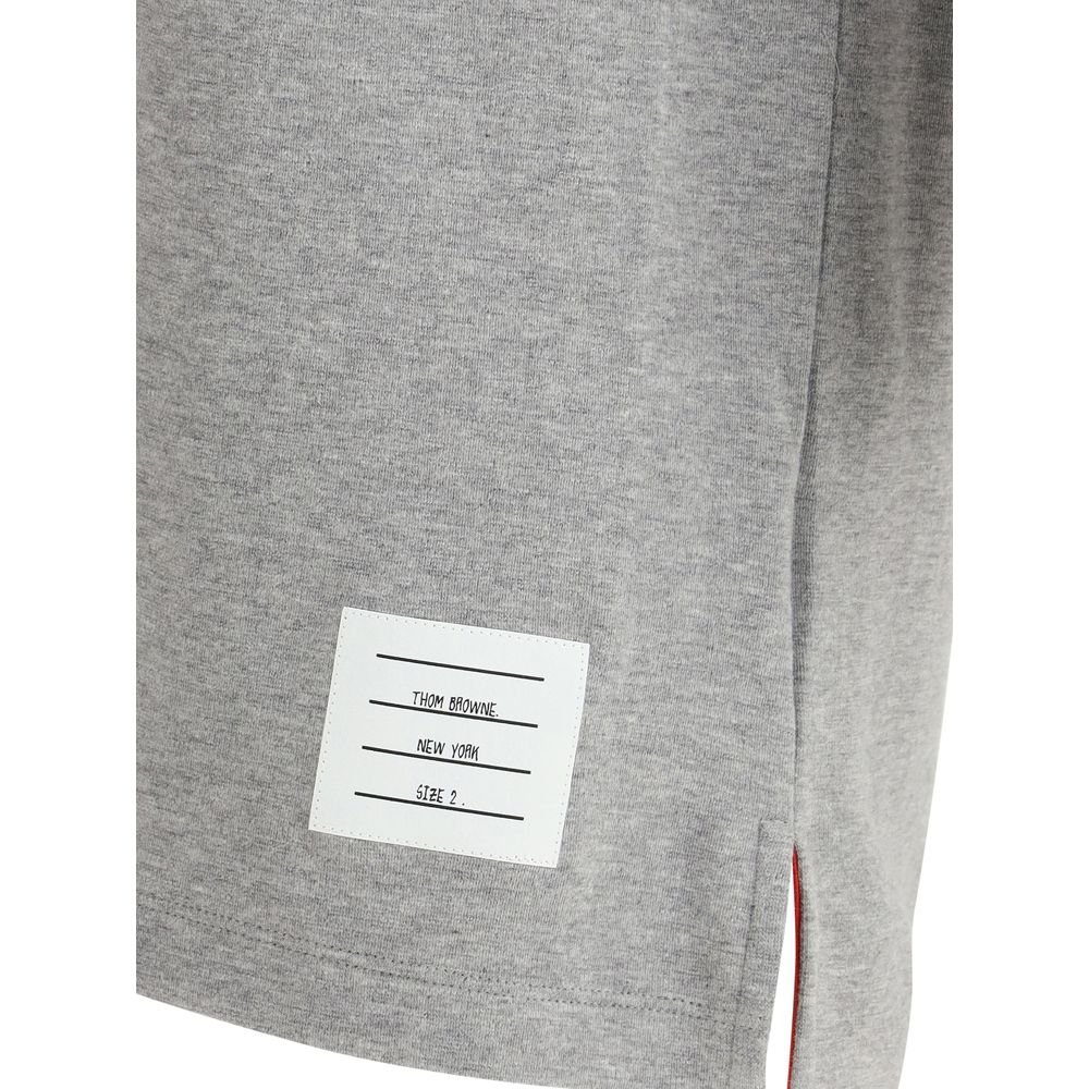 T-Shirt by Thom Browne for men in cotton gray, monogram & striped showcases a fashionable silhouette, elegantly detailed with a fashionable and for a sophisticated, high-fashion look.
