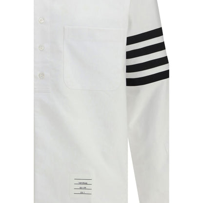 Dress Shirt by Thom Browne for men in cotton white showcases a sharp silhouette, elegantly detailed with a sharp and sharp .