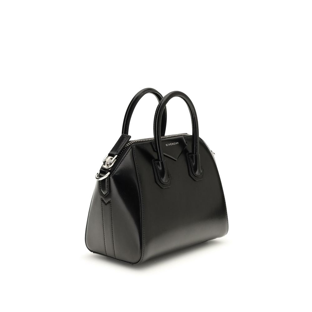Compact Evening Box Clutch Handbag by Givenchy for women in bos taurus calfskin leather black, silver & signature features a refined silhouette, showcasing a secure , organized , and versatile shoulder-strap, handle & adjustable-strap for a refined finish.