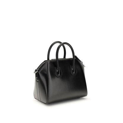 Compact Evening Box Clutch Handbag by Givenchy for women in bos taurus calfskin leather black, silver & signature features a contemporary silhouette, showcasing a secure , ample , and contemporary shoulder-strap, handle & adjustable-strap for a sophisticated look.