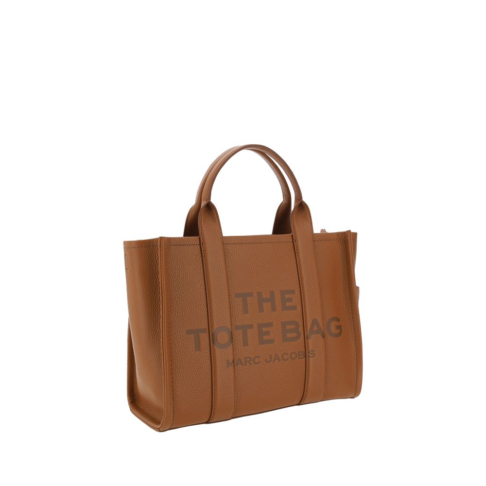 Medium Tote Handbag by Marc Jacobs for women in bos taurus calf grained leather brown & monogram features a contemporary silhouette, showcasing a secure zipper, ample , and contemporary shoulder-strap, handle & adjustable-strap for a sophisticated look.