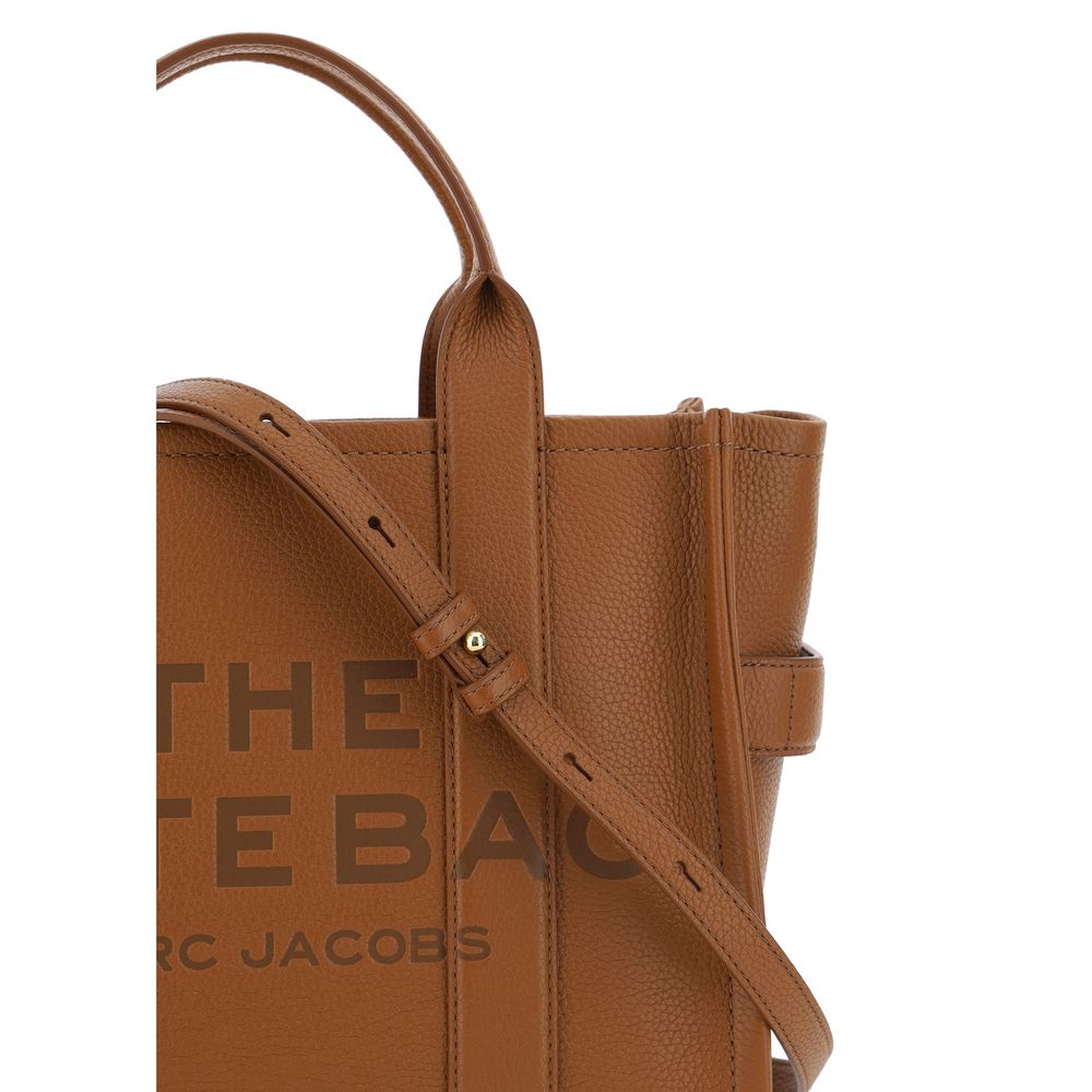 Medium Tote Handbag by Marc Jacobs for women in bos taurus calf grained leather brown & monogram features a refined silhouette, showcasing a secure zipper, organized , and versatile shoulder-strap, handle & adjustable-strap for a refined finish.