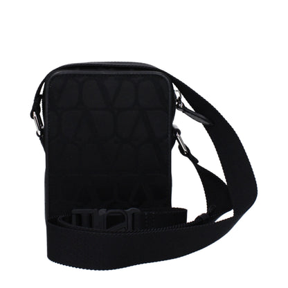 Small Crossbody Messenger Bag by Valentino Garavani for men in fabric black features a statement-making Fabric Small Crossbody Messenger Bag design with a secure zipper, statement-making external-pockets, and versatile crossbody-strap, shoulder-strap & adjustable-strap for a sophisticated look.
