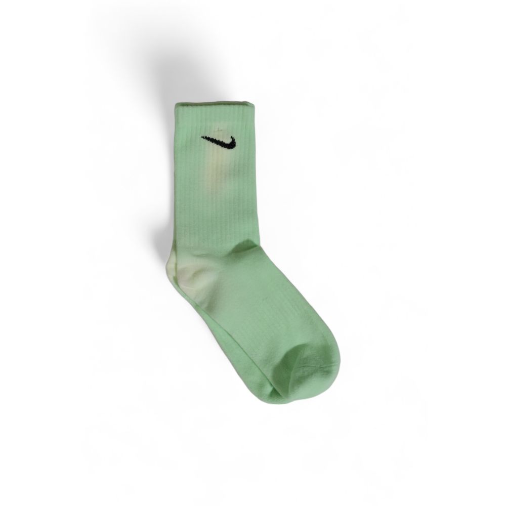 Socks by Nike for men in cotton green features a contemporary knit construction, showcasing the sophisticated design of this Men's Cotton Socks with its contemporary finish.