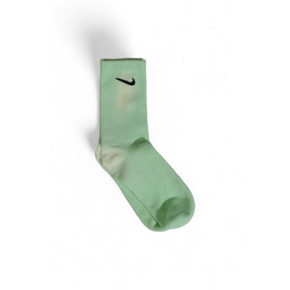 Socks by Nike for men in cotton green features a contemporary knit construction, showcasing the sophisticated design of this Men's Cotton Socks with its contemporary finish.