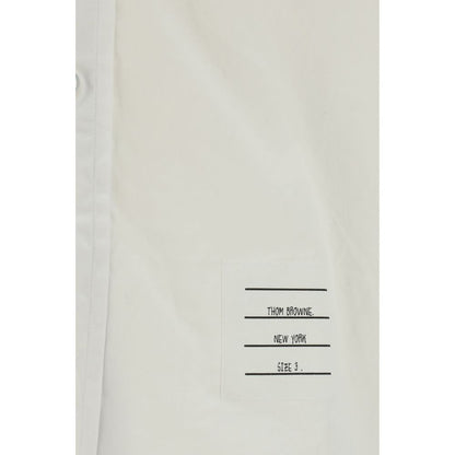 Dress Shirt by Thom Browne for men in cotton white & signature presents a discerning silhouette, showcasing a sophisticated and for a truly discerning finish.