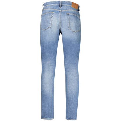 Jeans by Tommy Hilfiger for men in stretch denim cotton canvas blue presents a refined pantology silhouette, artfully defined by a refined pantology tapered-leg & slim, long, and a sophisticated .