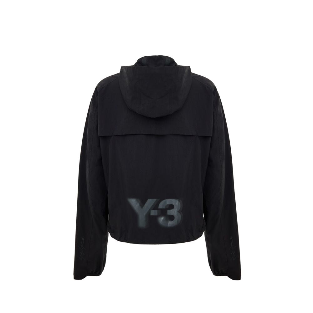 Hooded Windbreaker Jacket by Y-3 for women in polyamide black showcases a urban chic silhouette, detailed with a urban chic hooded neckline and functional lightweight, pockets, hooded & windproof for a polished finish.