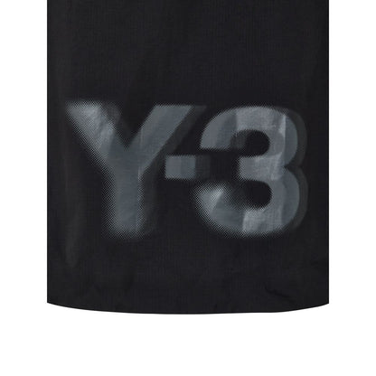 Hooded Windbreaker Jacket by Y-3 for women in polyamide black features an perennial silhouette with a refined hooded neckline and perennial lightweight, pockets, hooded & windproof for a sophisticated weather-resistant look.