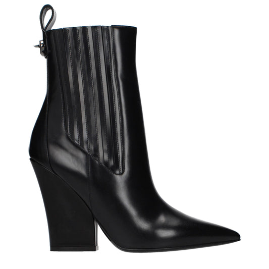 Ankle Boots by Valentino Garavani for women in leather black features an avant-garde Women's Leather Ankle Boots silhouette, defined by a sophisticated and a avant-garde .