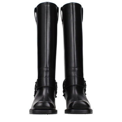 Boots by Valentino Garavani for women in leather black features an dynamic silhouette, showcasing the dynamic Women's Leather Boots design with its distinctive and elegant .