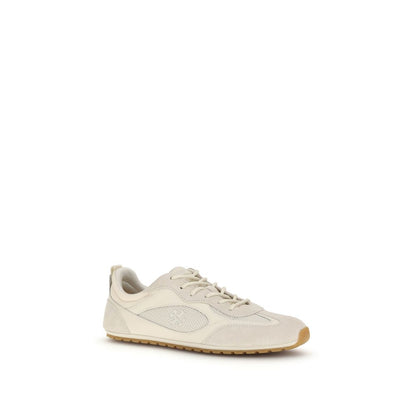 Sneakers by Tory Burch for women in polyester & bos taurus calf leather cream presents a sumptuous silhouette, artfully capturing the essence of the Women's Low Top Polyester & Bos Taurus Calf Leather Sneakers with its sumptuous low-top style design.