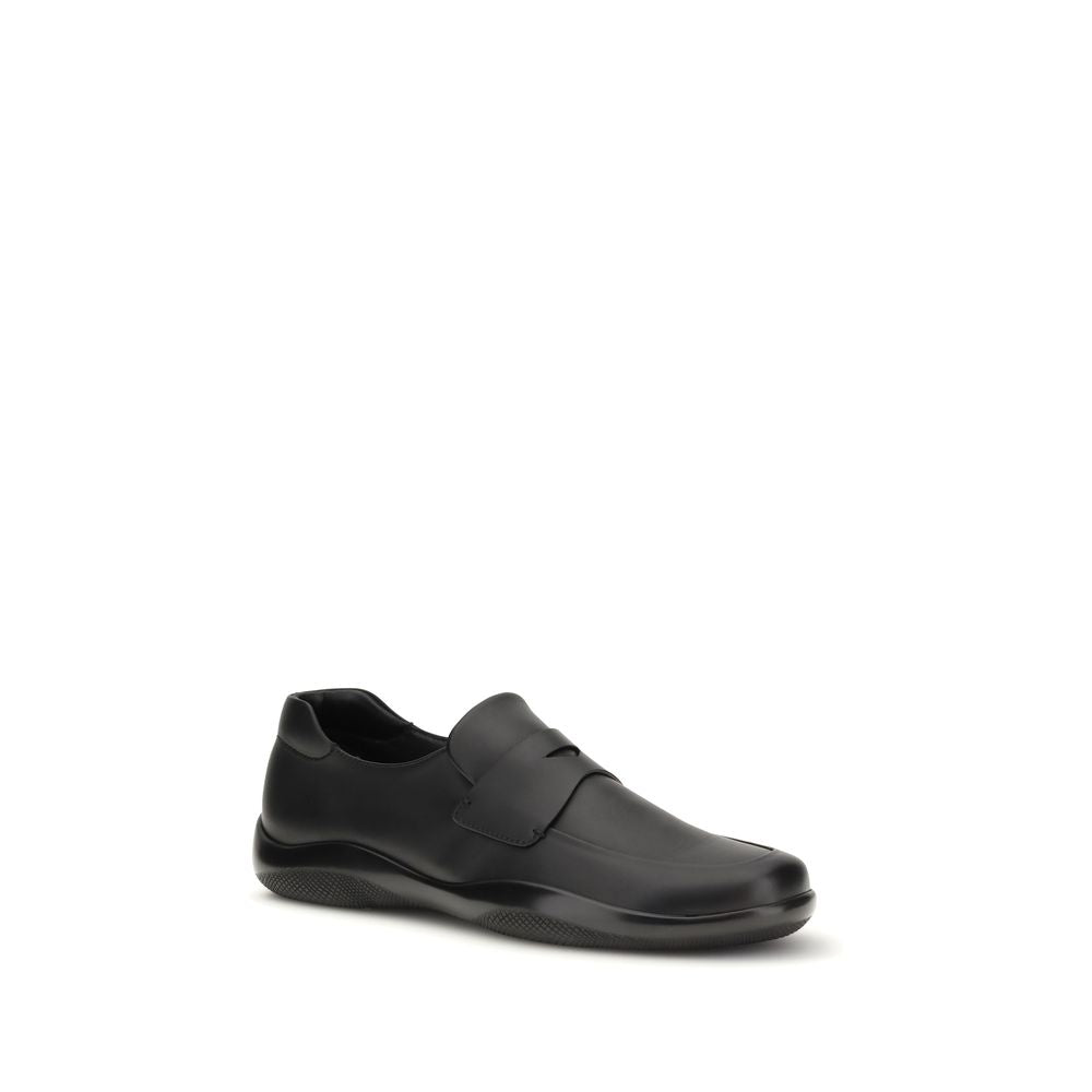 Moccasin Moccasins Loafer Slip-On Shoes by Prada for men in bos taurus calf leather black showcases a timeless silhouette from the Men's Bos Taurus Calf Leather Moccasin Moccasins Loafer Slip-On Shoes collection, featuring a timeless and for a timeless finish.