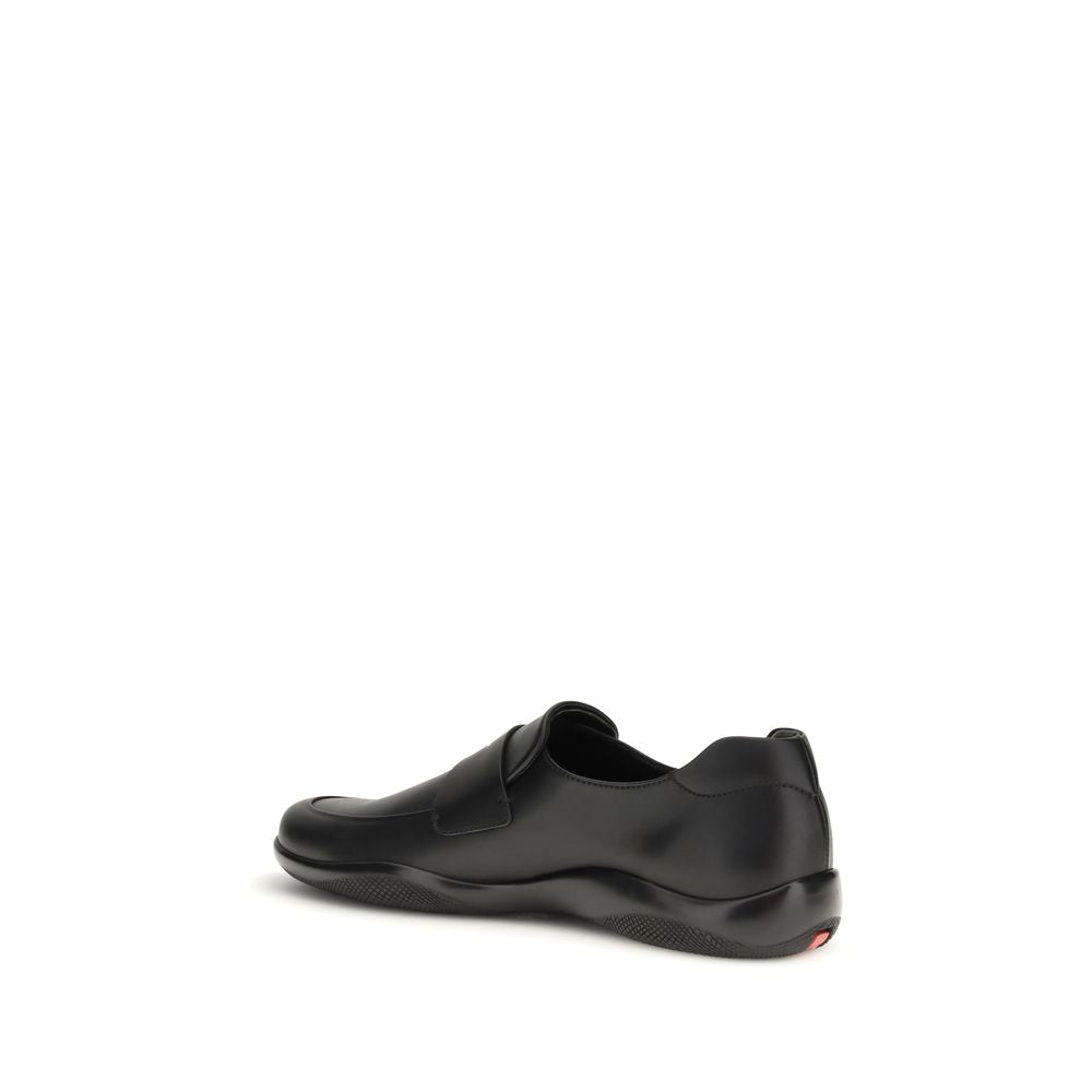 Moccasin Moccasins Loafer Slip-On Shoes by Prada for men in bos taurus calf leather black features an effortless chic silhouette, showcasing the Men's Bos Taurus Calf Leather Moccasin Moccasins Loafer Slip-On Shoes design with an effortless chic and a for a effortless chic look.