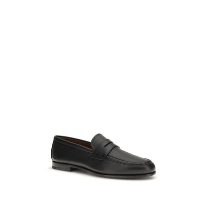 Loafer Slip-On Shoes by Church's for men in bos taurus calfskin leather black showcases a timeless silhouette from the Men's Bos Taurus Calfskin Leather Loafer Slip-On Shoes collection, featuring a timeless and for a timeless finish.