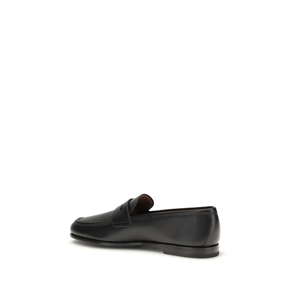 Loafer Slip-On Shoes by Church's for men in bos taurus calfskin leather black features an effortless chic silhouette, showcasing the Men's Bos Taurus Calfskin Leather Loafer Slip-On Shoes design with an effortless chic and a for a effortless chic look.