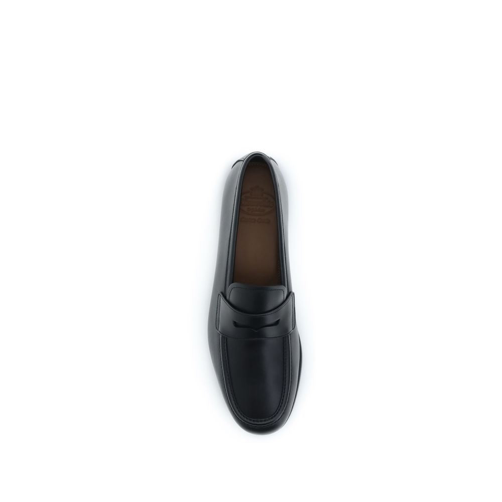 Loafer Slip-On Shoes by Church's for men in bos taurus calfskin leather black showcases a timeless silhouette from the Men's Bos Taurus Calfskin Leather Loafer Slip-On Shoes collection, featuring a timeless and for a timeless finish.