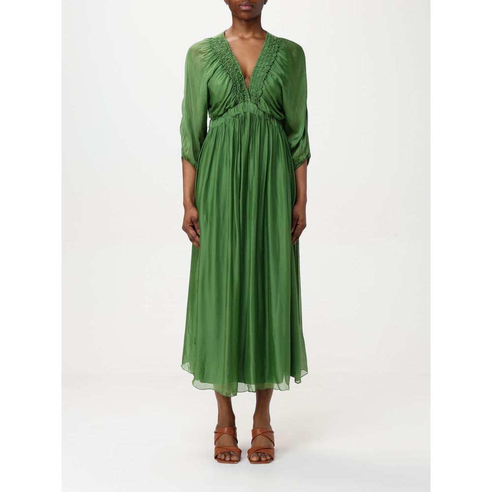 Dress by Kaos for women in silk green features an cute silhouette, detailed with a short-sleeve and that elegantly flows into a cute midi short.