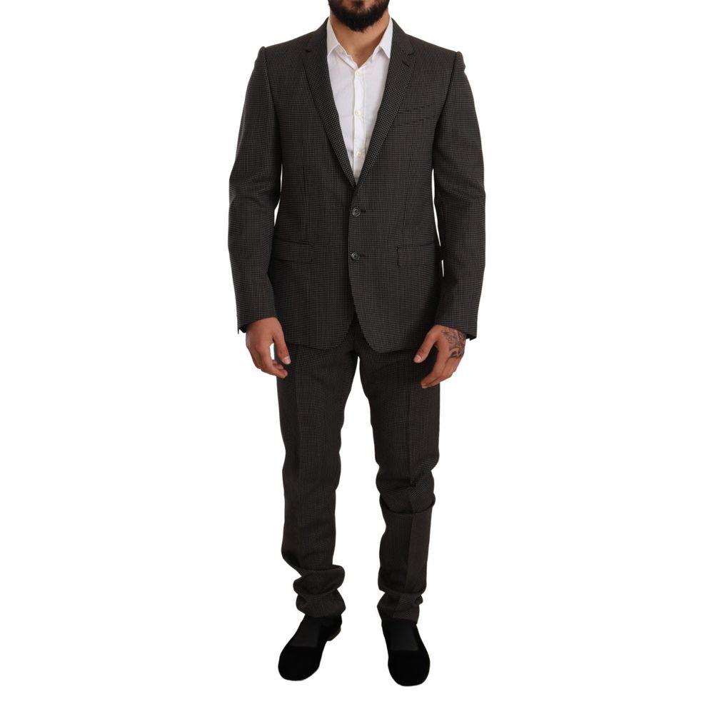 This Pant Suit by Dolce & Gabbana for men in virgin wool black, gray & patterned presents a discerning silhouette, featuring a sophisticated single-breasted neckline and a discerning slim for a refined and polished look.