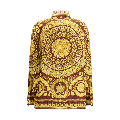 Shirt by Versace for women in silk bordeaux, patterned & print showcases a sharp silhouette, elegantly detailed with a sharp point-collar neckline and sharp .